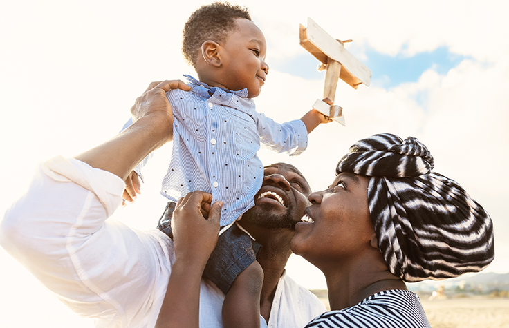 Family-holding-child.